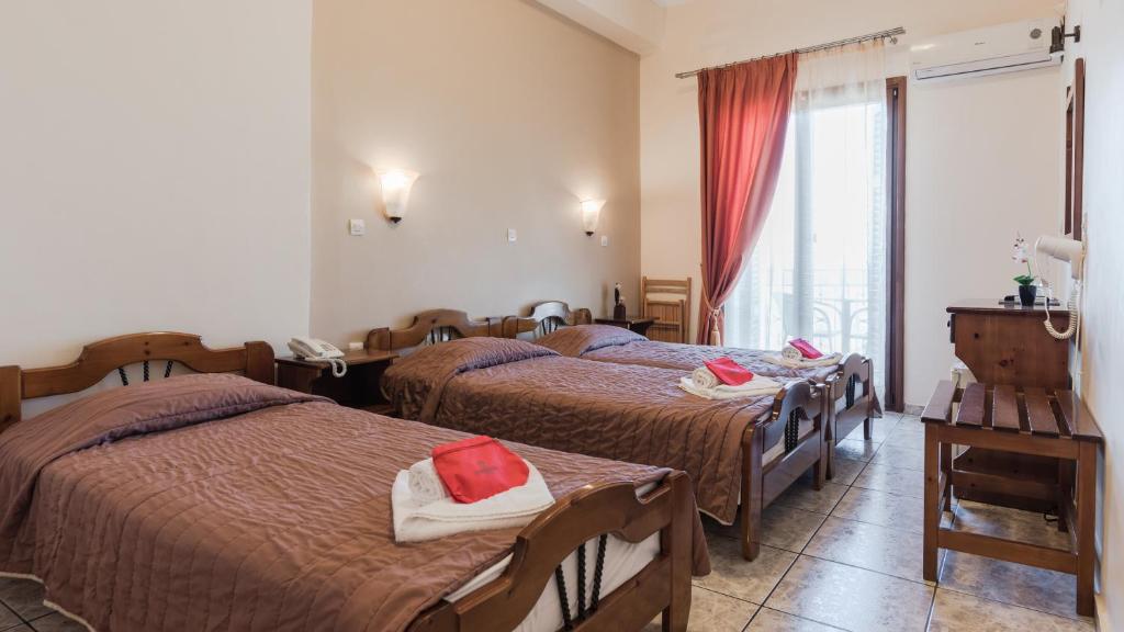 Postel nebo postele na pokoji v ubytování Poseidonio Hotel