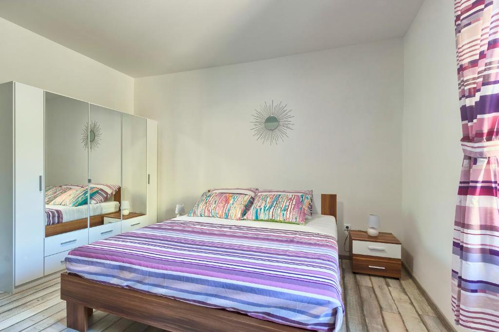 Postel nebo postele na pokoji v ubytování Apartment Amfiteatar Moris
