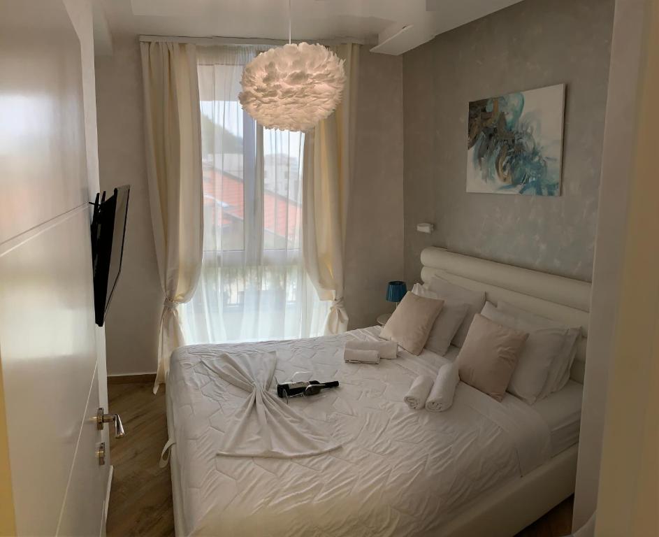 Postel nebo postele na pokoji v ubytování Butterfly Apartman