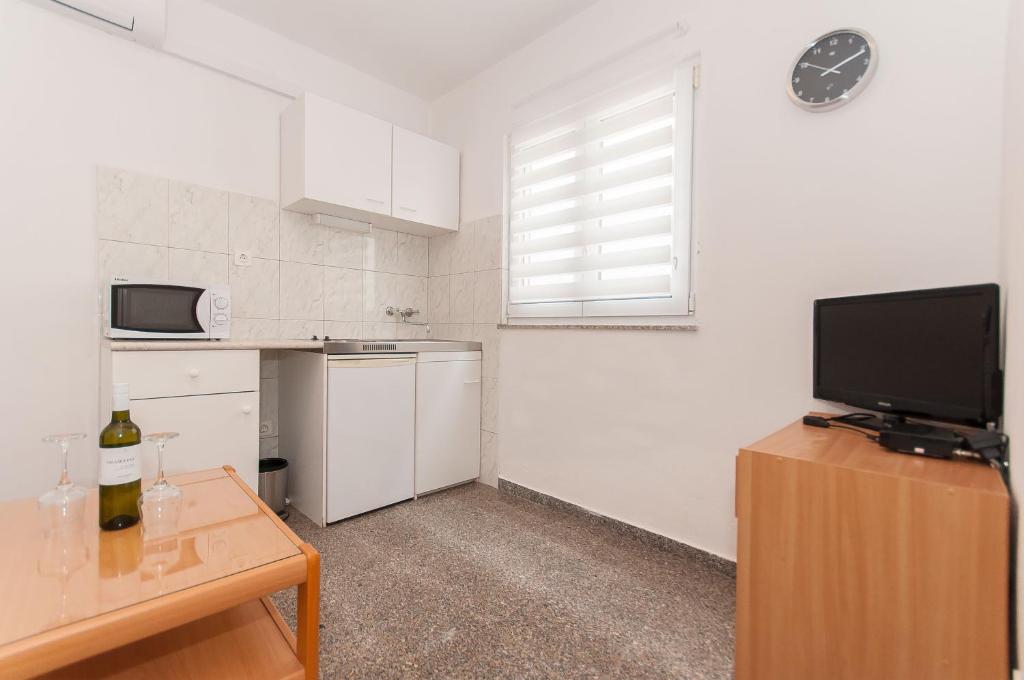 Kuchyň nebo kuchyňský kout v ubytování Apartmani Vesna