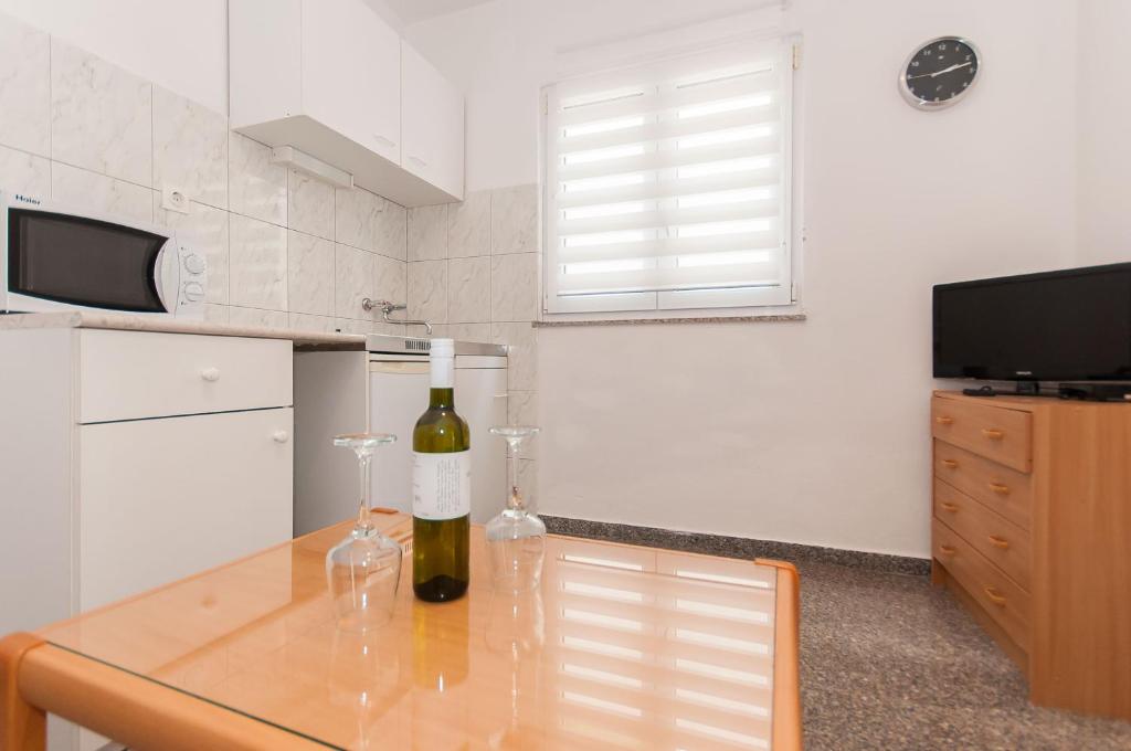 Kuchyň nebo kuchyňský kout v ubytování Apartmani Vesna
