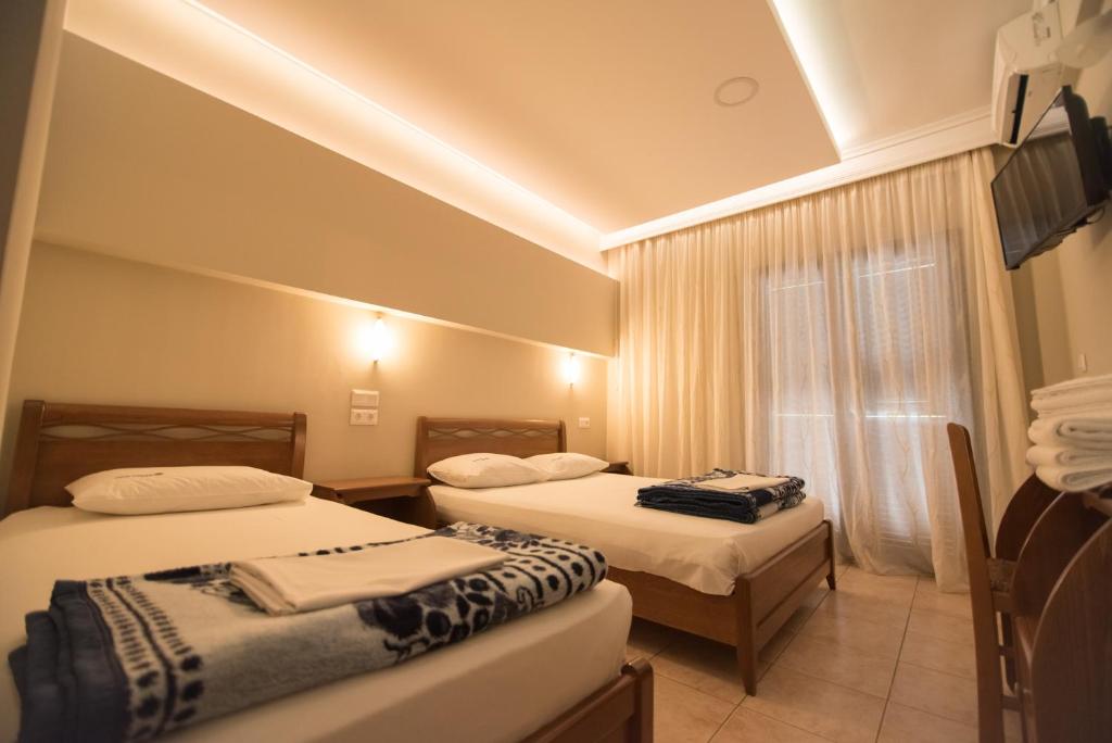 Łóżko lub łóżka w pokoju w obiekcie acquablue apartments