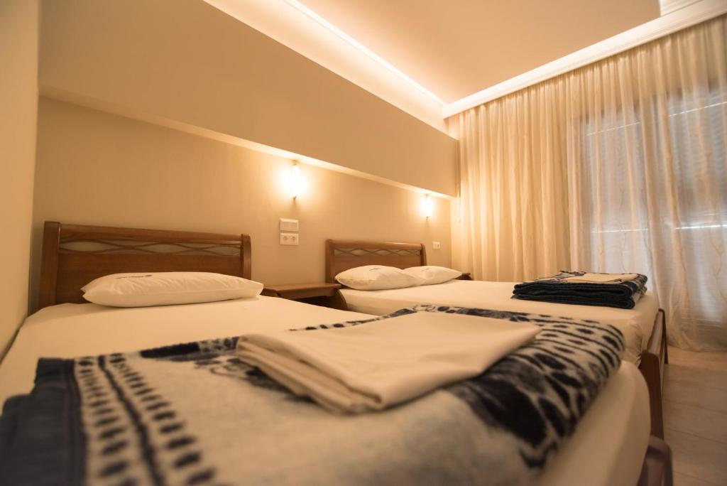 Łóżko lub łóżka w pokoju w obiekcie acquablue apartments