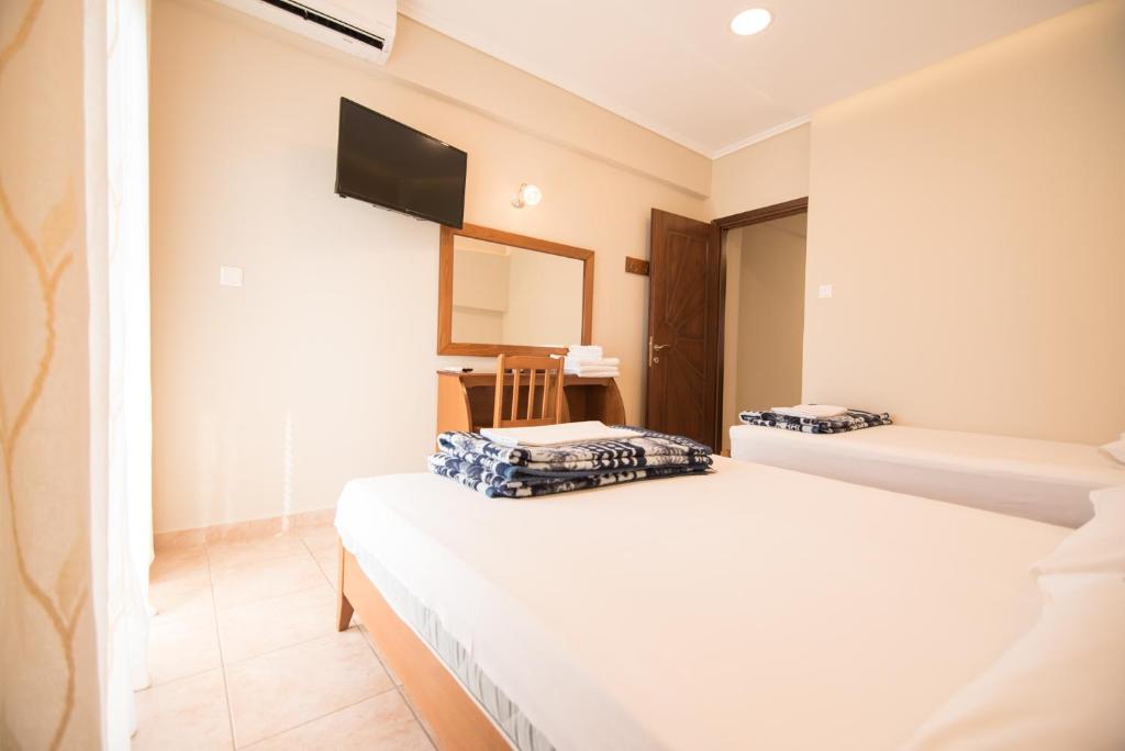 Łóżko lub łóżka w pokoju w obiekcie acquablue apartments