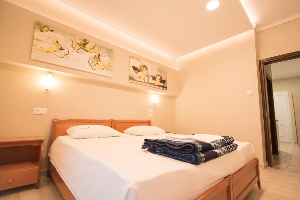 Łóżko lub łóżka w pokoju w obiekcie acquablue apartments