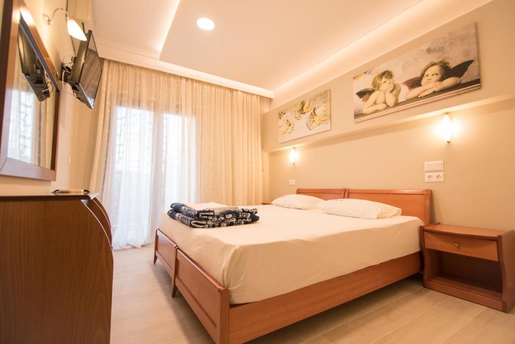 Łóżko lub łóżka w pokoju w obiekcie acquablue apartments