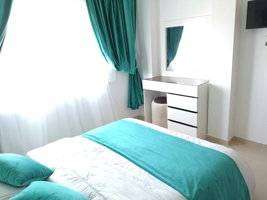 Postel nebo postele na pokoji v ubytování Kariat Cabo - Appartement Charmant, Climatisé avec Vue Piscine