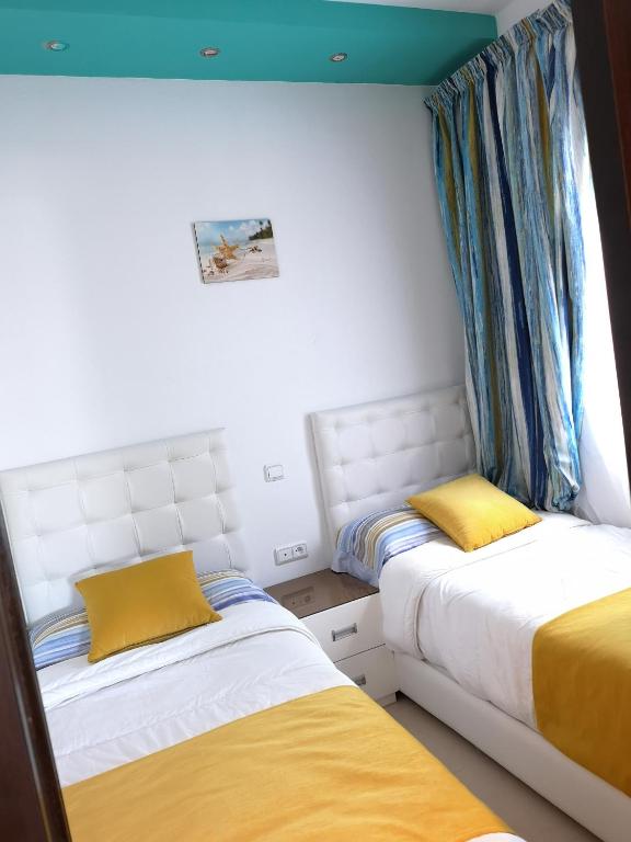 Postel nebo postele na pokoji v ubytování Kariat Cabo - Appartement Charmant, Climatisé avec Vue Piscine