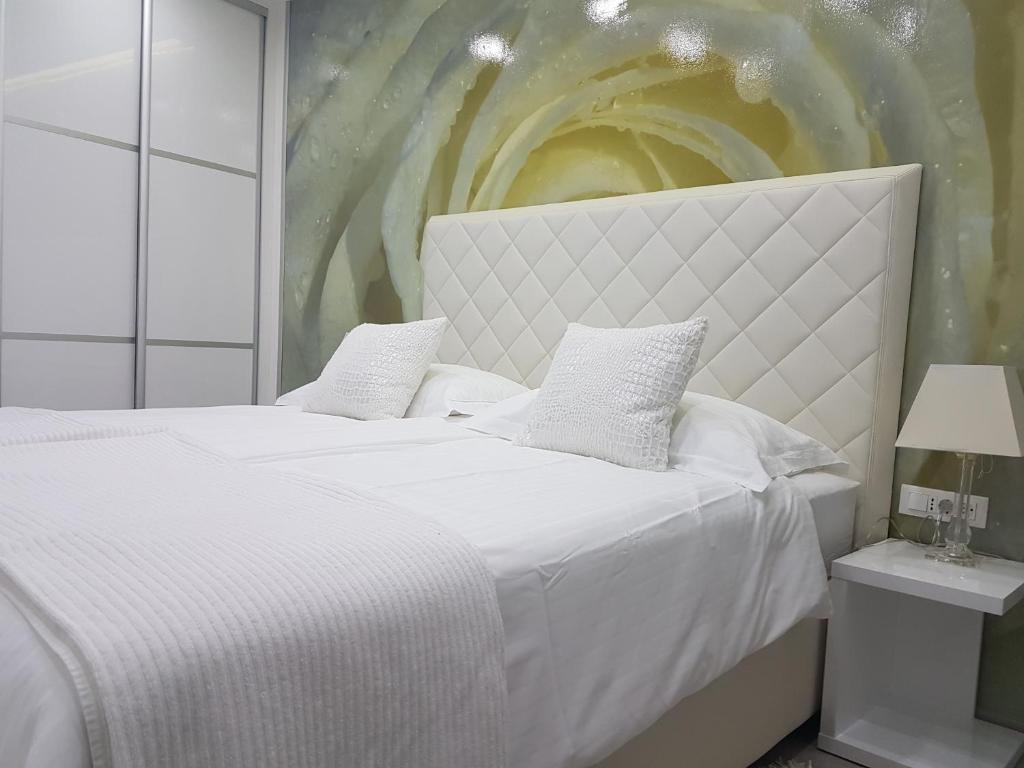 Posteľ alebo postele v izbe v ubytovaní Palladium City Center Apartments