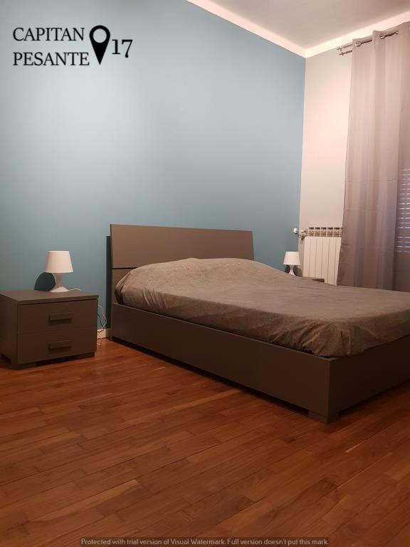 Posteľ alebo postele v izbe v ubytovaní Trilocale Piazza Colombo