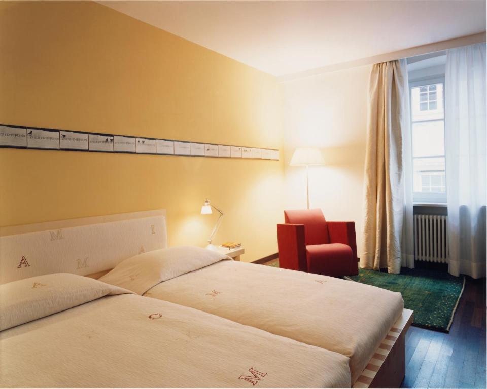 Postel nebo postele na pokoji v ubytování Hotel Greif, a Member of Design Hotels