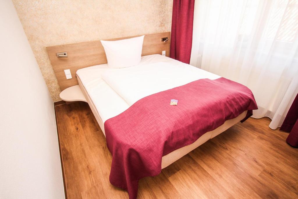 Postel nebo postele na pokoji v ubytování Hotel Ohlendorfs Gasthaus
