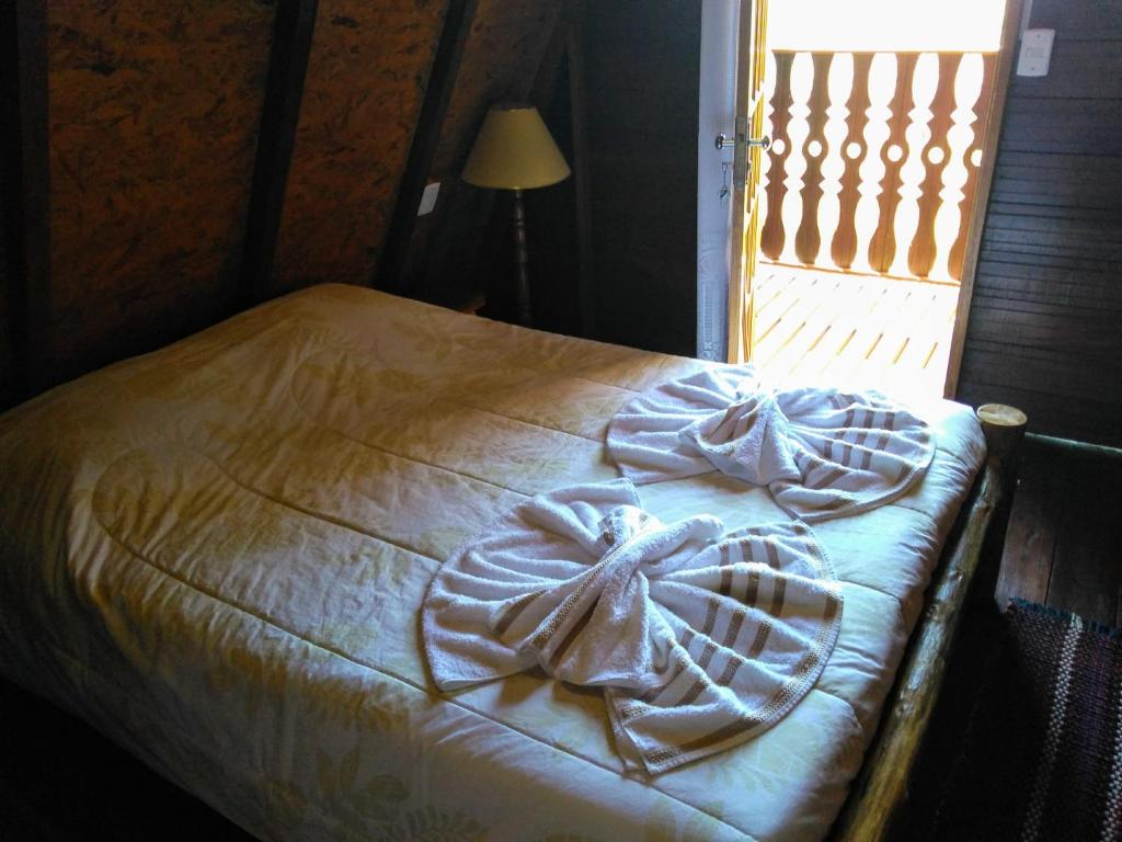Postel nebo postele na pokoji v ubytování Recanto Mauá - Chalé Azaleia