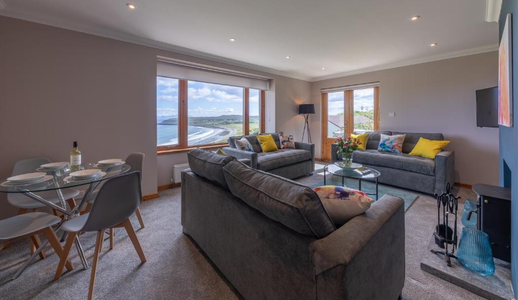 a living room with a couch and a table at Taste of the Sea in Staffin