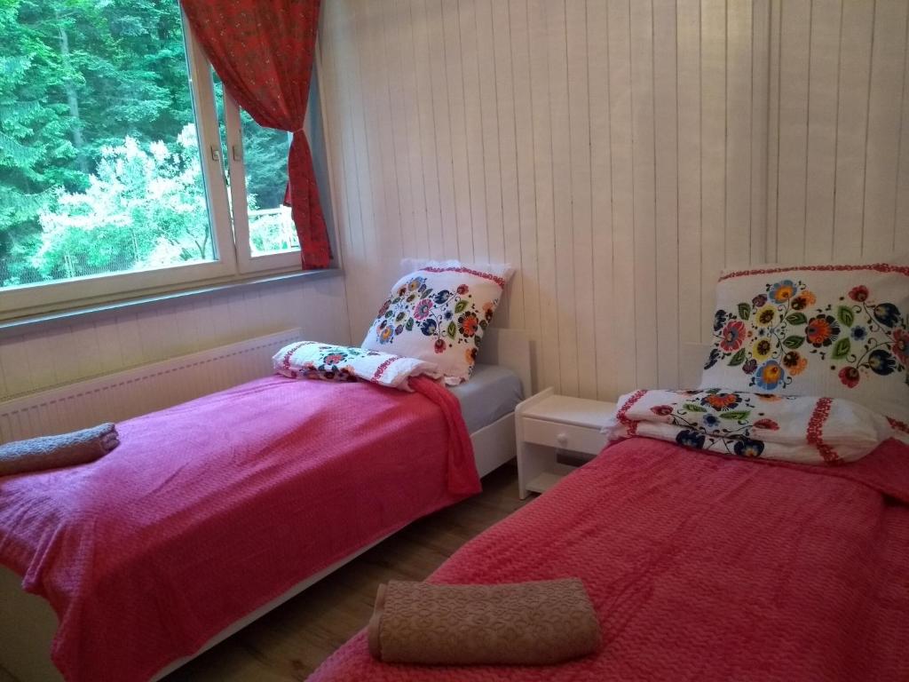 Postel nebo postele na pokoji v ubytování Willa Wiślok