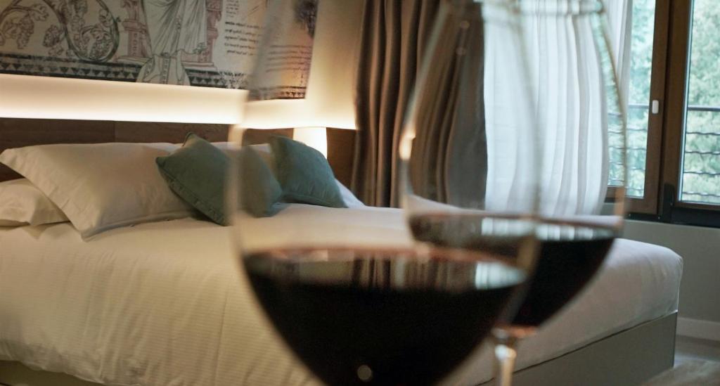 Postel nebo postele na pokoji v ubytování AGRITURISMO ACINATICO WINE RELAIS