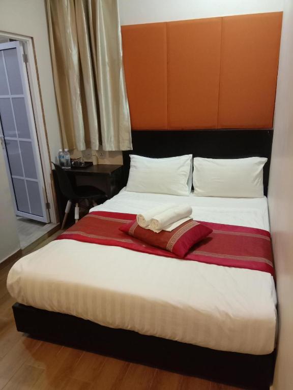 Postel nebo postele na pokoji v ubytování D'Spark Hotel Bayu