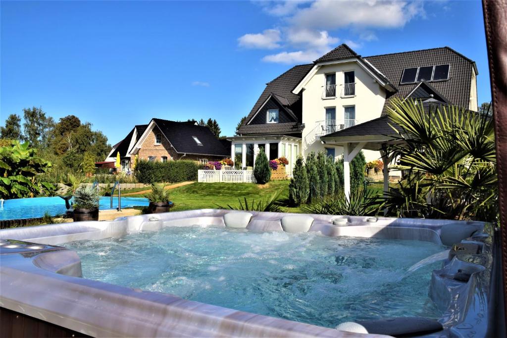 a hot tub in the backyard of a house at Fewo Traum in Neppermin