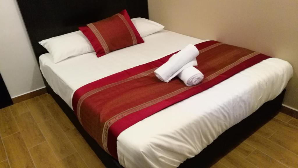 Postel nebo postele na pokoji v ubytování D'Spark Hotel Bayu