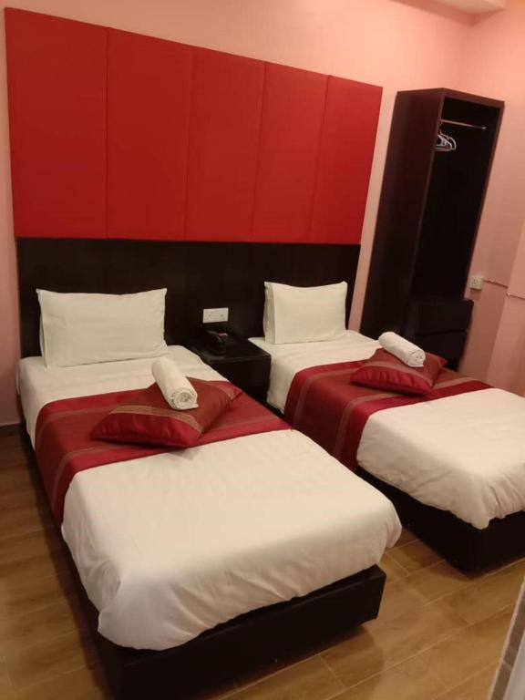 Postel nebo postele na pokoji v ubytování D'Spark Hotel Bayu