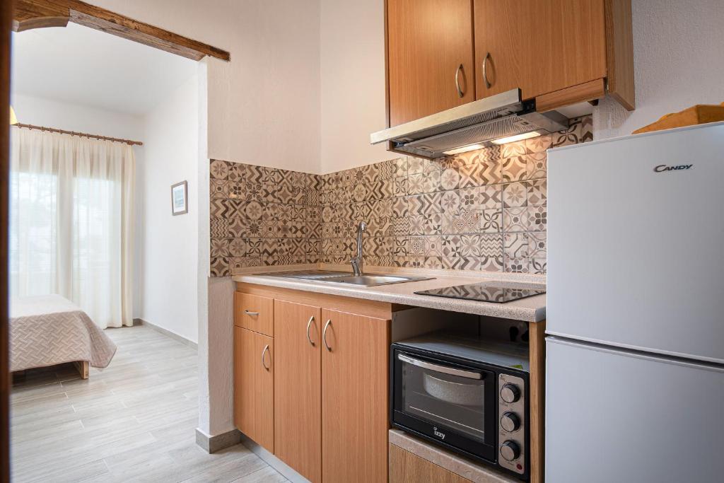 Kuchyň nebo kuchyňský kout v ubytování Akti House Psarogiannis Apartments & Studios