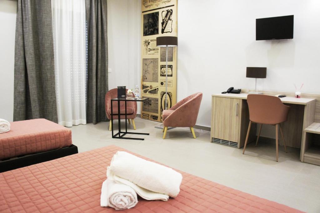 Postel nebo postele na pokoji v ubytování Albergo D'Onofrio