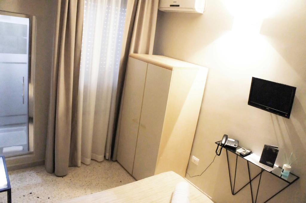 TV a/nebo společenská místnost v ubytování Albergo D'Onofrio