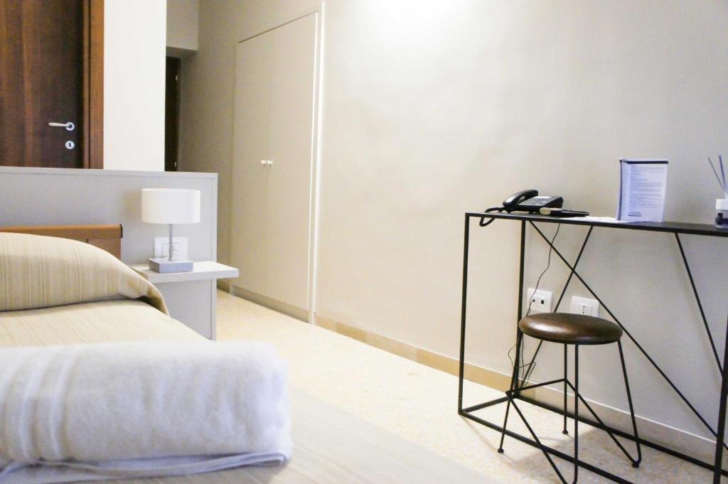 Postel nebo postele na pokoji v ubytování Albergo D'Onofrio