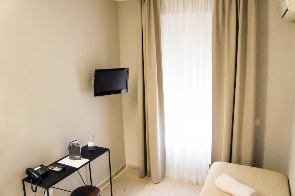 TV a/nebo společenská místnost v ubytování Albergo D'Onofrio