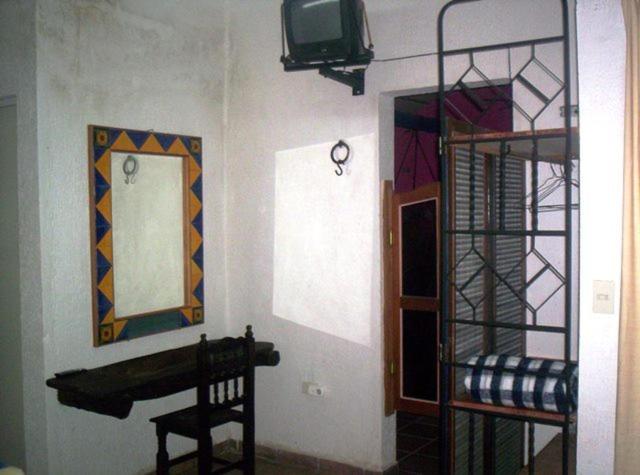 TV a/nebo společenská místnost v ubytování Posada El Jardin
