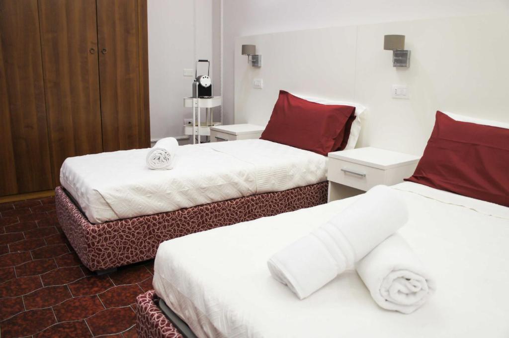 Postel nebo postele na pokoji v ubytování Albergo D'Onofrio