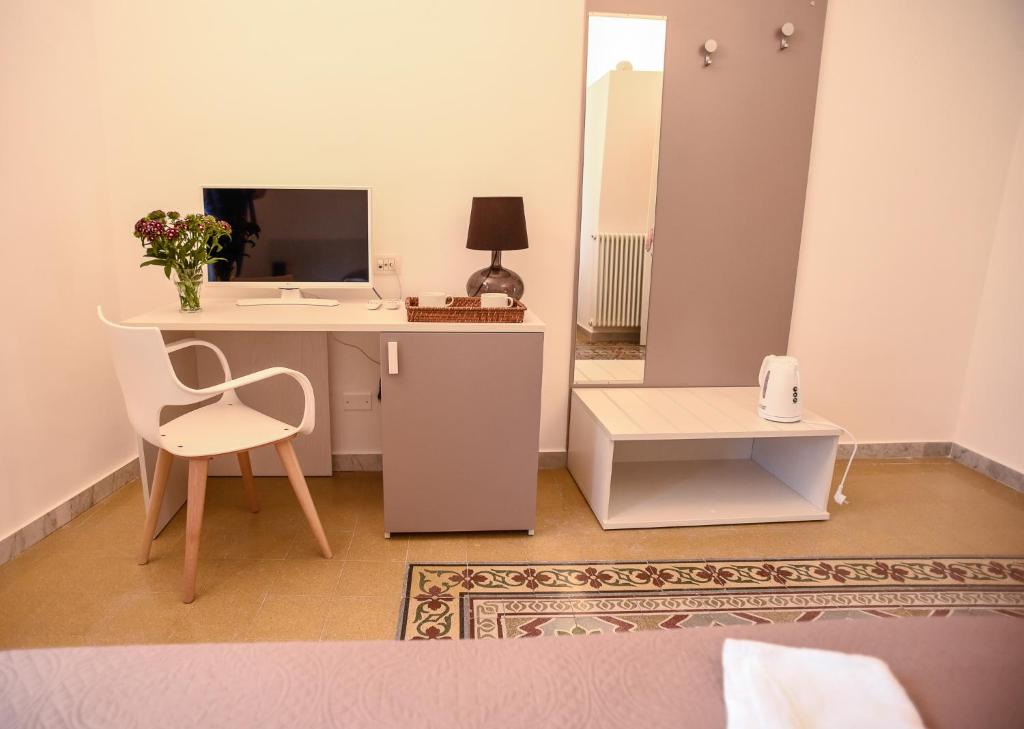 Televízia a/alebo spoločenská miestnosť v ubytovaní Rooms 19 B&B