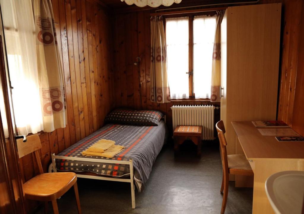 Postel nebo postele na pokoji v ubytování Hôtel de Torgon