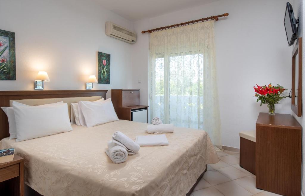 Postel nebo postele na pokoji v ubytování Hotel Stefani
