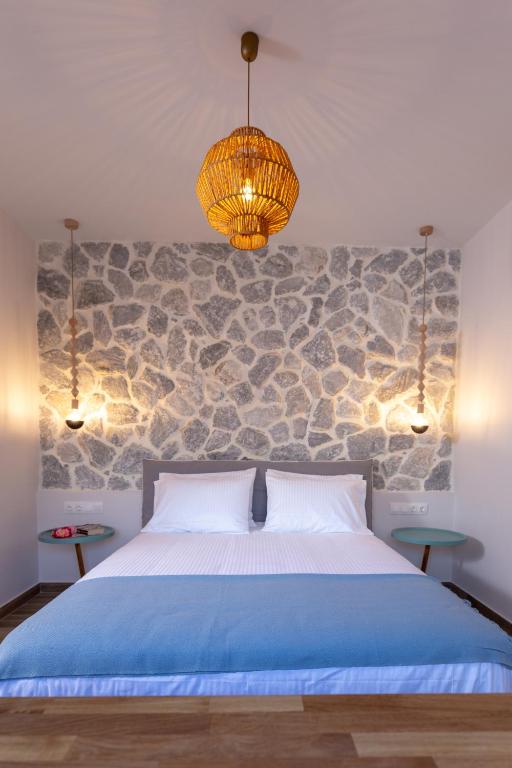 Postel nebo postele na pokoji v ubytování Rapanos Apartments