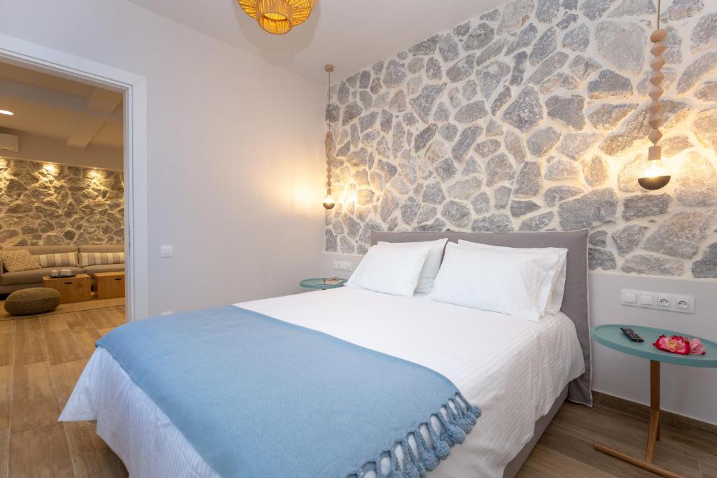 Postel nebo postele na pokoji v ubytování Rapanos Apartments