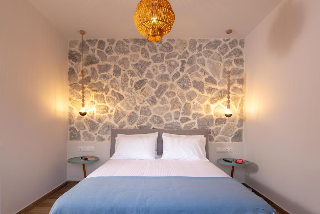 Postel nebo postele na pokoji v ubytování Rapanos Apartments
