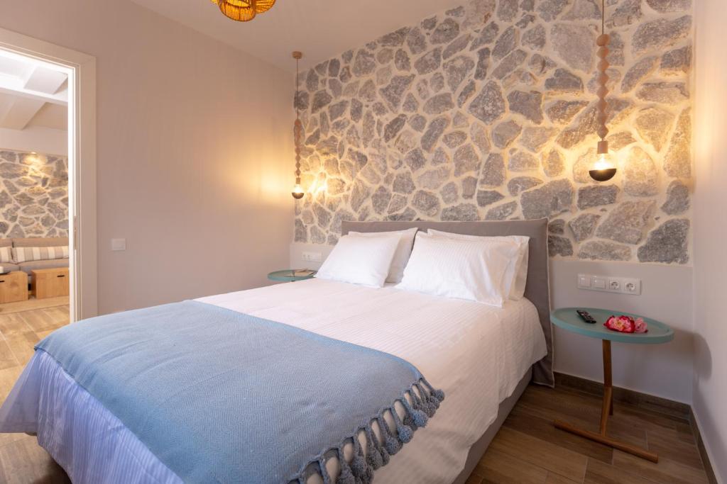 Postel nebo postele na pokoji v ubytování Rapanos Apartments