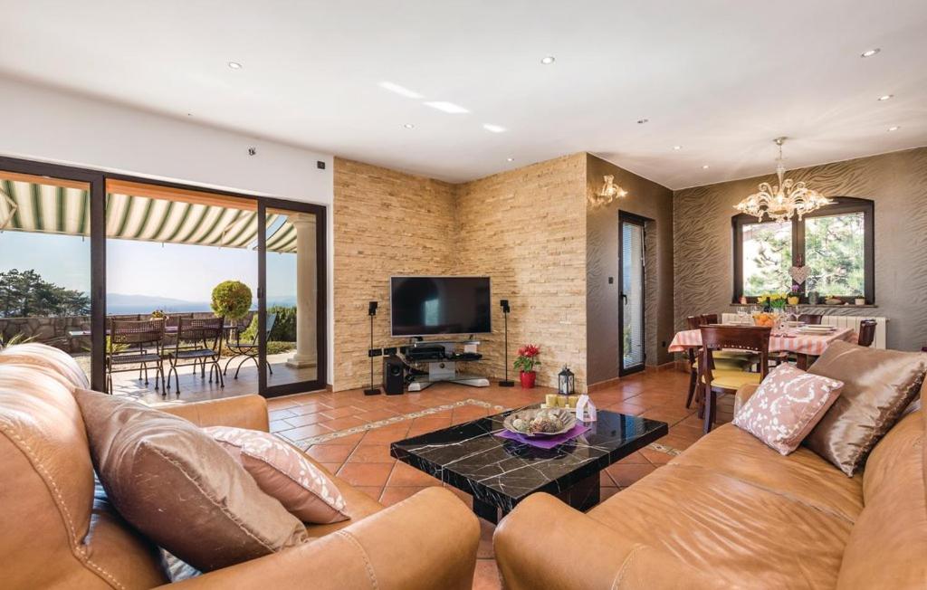 Televízia a/alebo spoločenská miestnosť v ubytovaní Sea View - Casa di Arijana