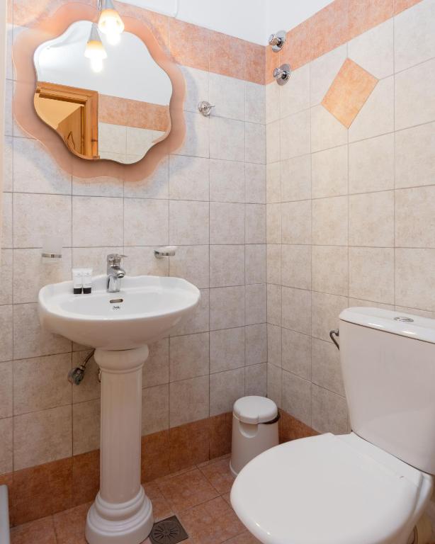 Koupelna v ubytování Poseidonio Hotel