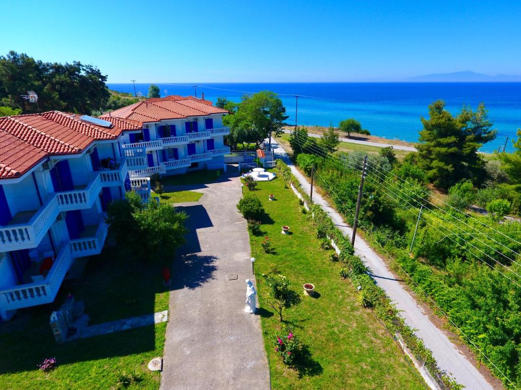 an aerial view of a building with the ocean in the background at Hotel Paraktio in Nea Kalikratia