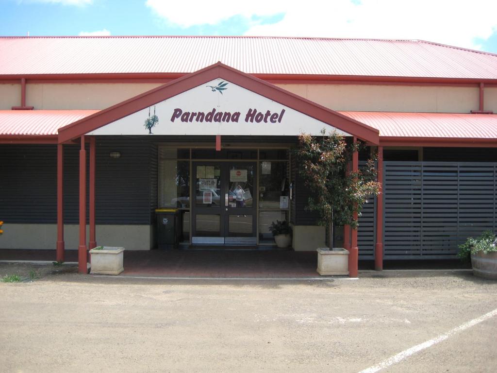 a building with the entrance to a panama hotel at Parndana Hotel Cabins in Parndana