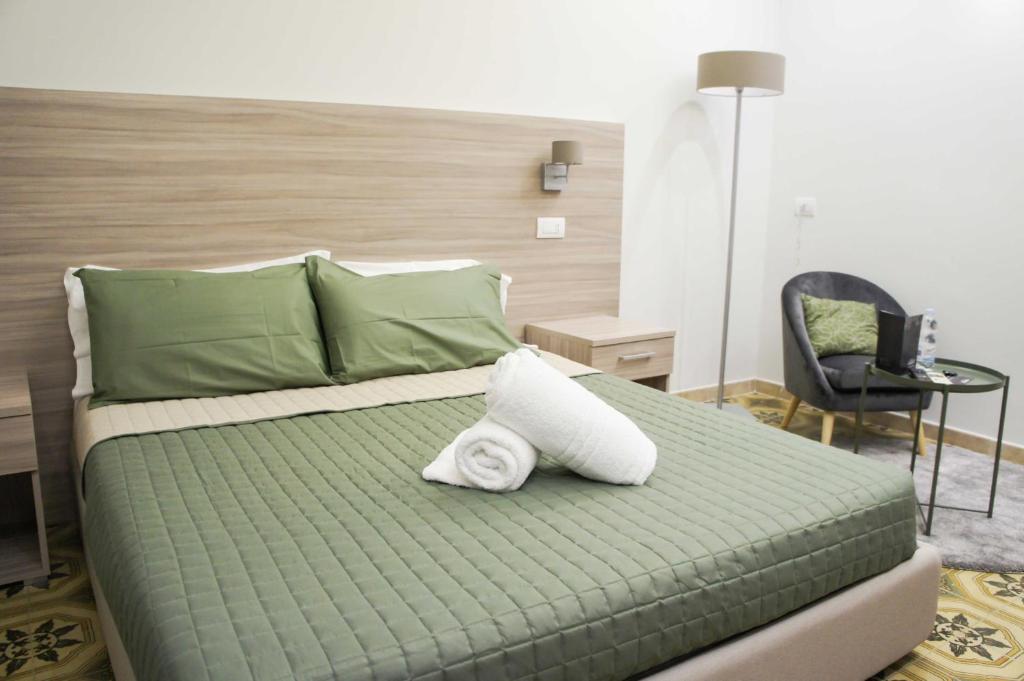 Postel nebo postele na pokoji v ubytování Albergo D'Onofrio