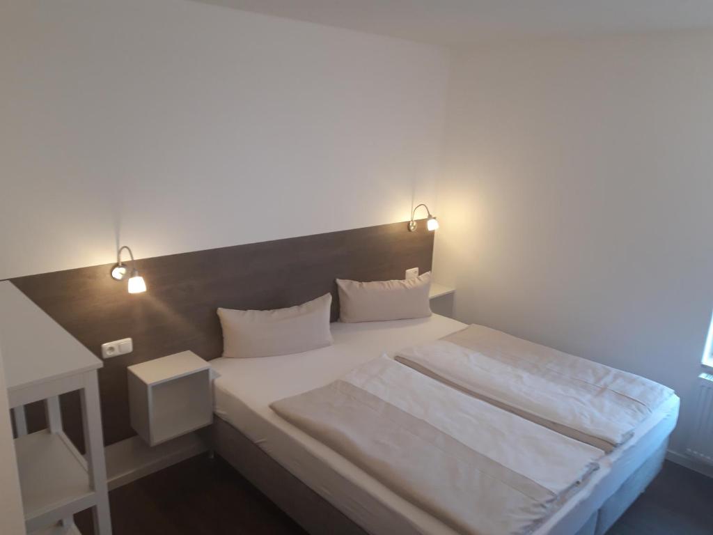 Letto o letti in una camera di Hotel Weinert