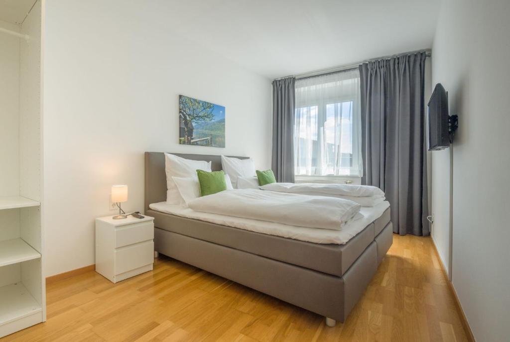 Postel nebo postele na pokoji v ubytování City Appartements Villach