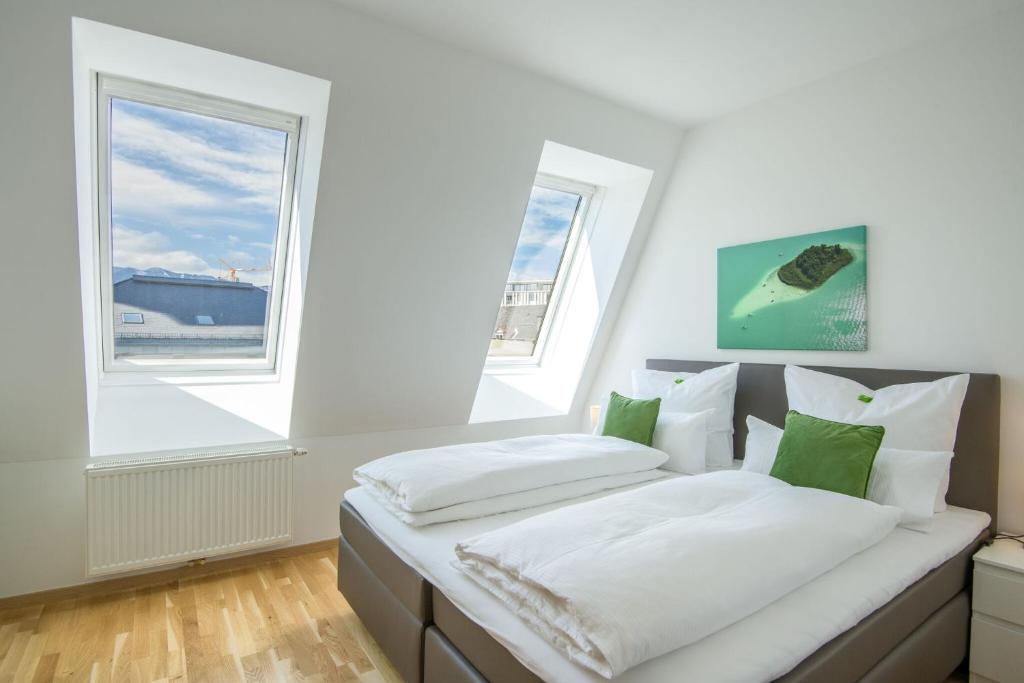 Postel nebo postele na pokoji v ubytování City Appartements Villach