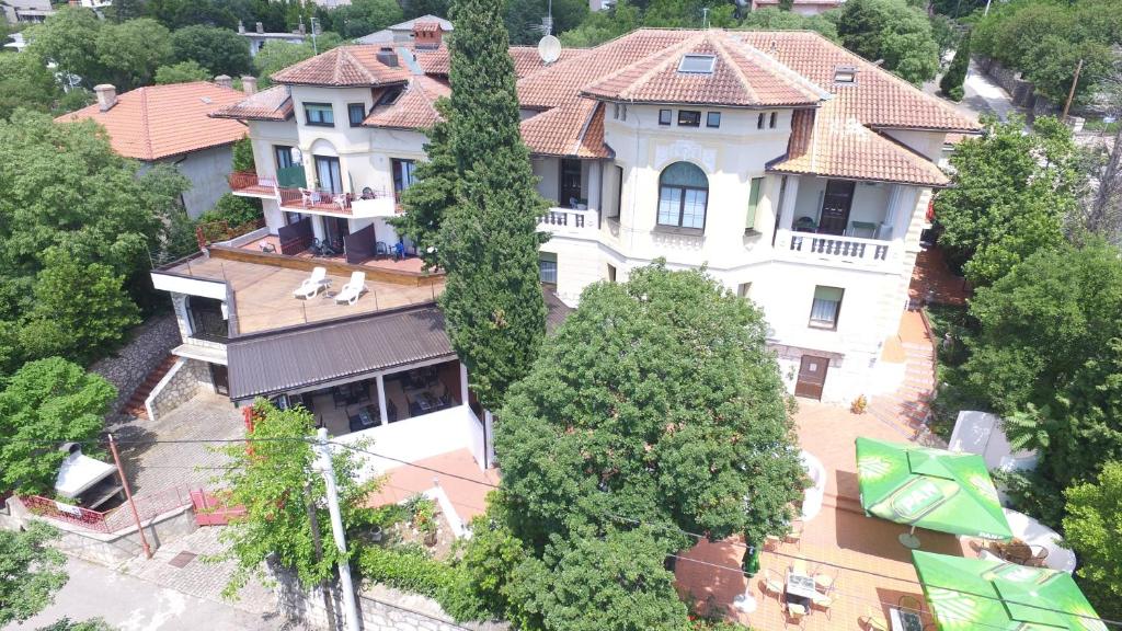 an overhead view of a large house with trees at Hotel Ruža in Novi Vinodolski
