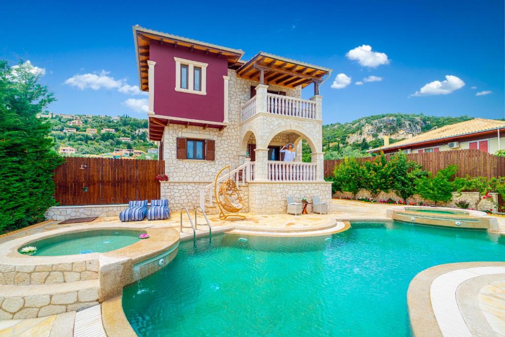 a house with a swimming pool in the backyard at Fairytale Villa in Lefkada Town