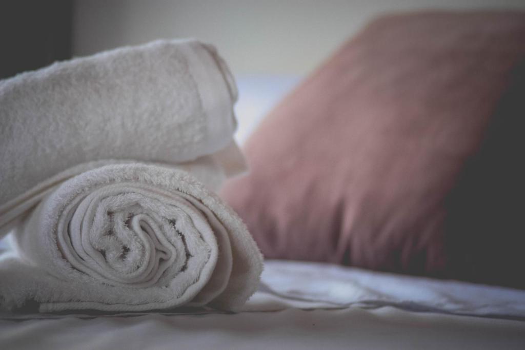 Postel nebo postele na pokoji v ubytování DAHLIA Guesthouse