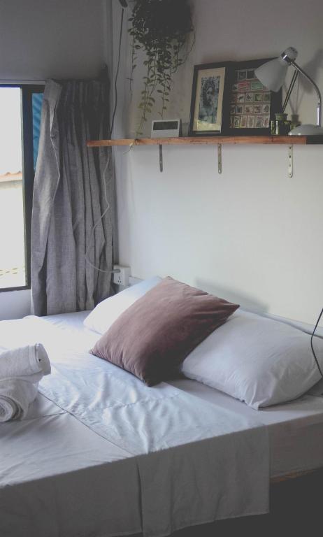 Postel nebo postele na pokoji v ubytování DAHLIA Guesthouse